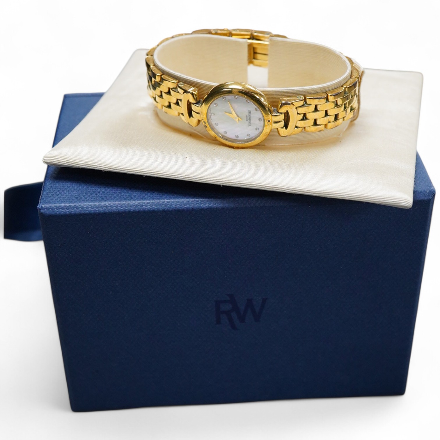A lady's 2002 gilt steel Raymond Weil quartz wrist watch, with mother of pearl dial and simulated diamond dot numerals, with box and papers.